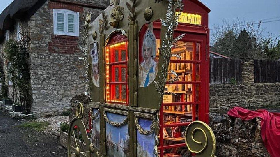 Gold coach built around a red phone box