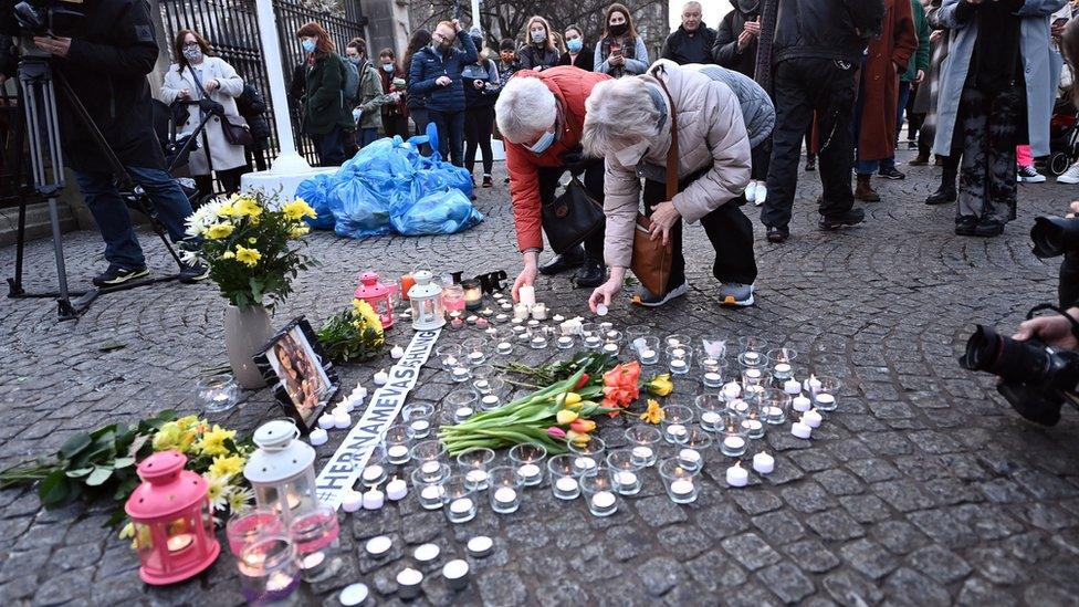 Flowers and candles were laid at Belfast City Hall