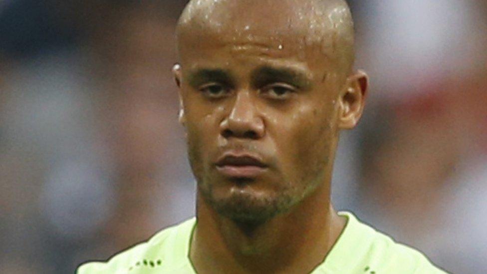 Vincent Kompany is helped off the pitch