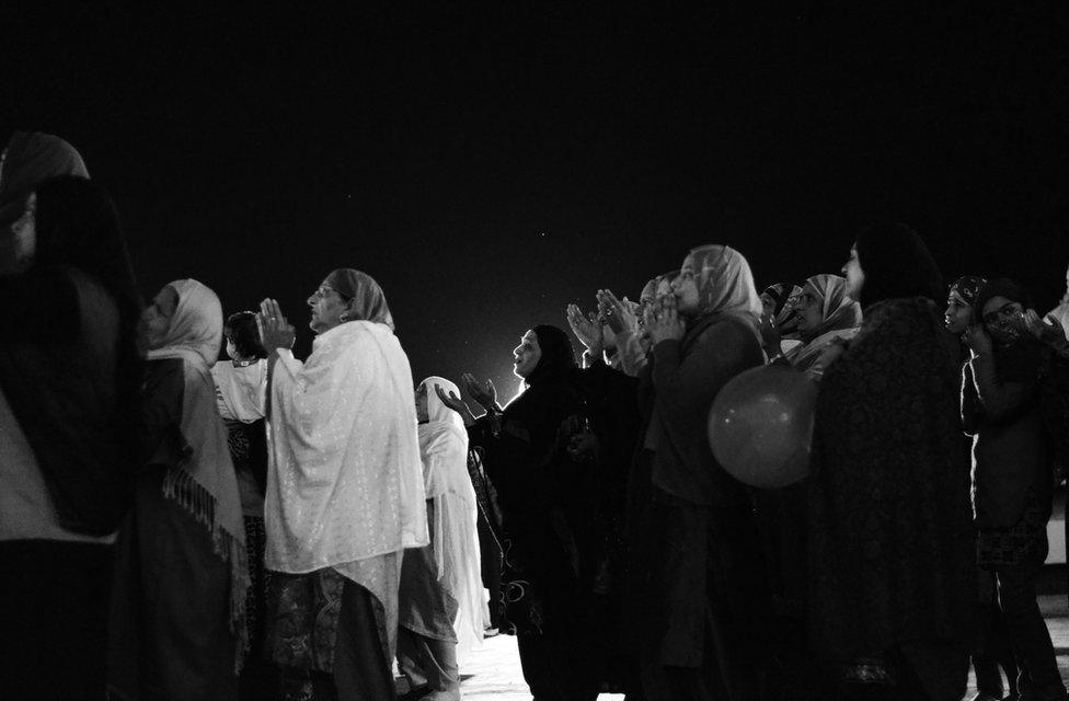 People praying at Hazratbal shrine which is flanked by Dal Lake