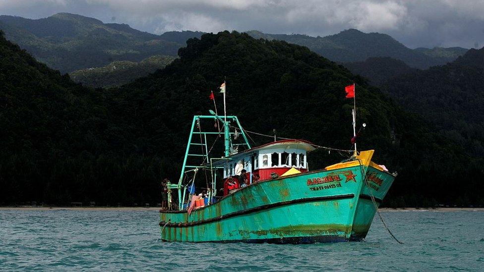 A small boat carrying asylum seekers moored in Aceh, Indonesia