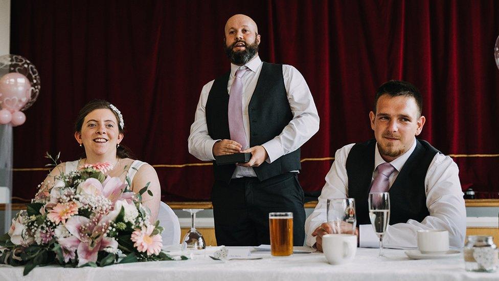 A bride, best man and groom at a wedding