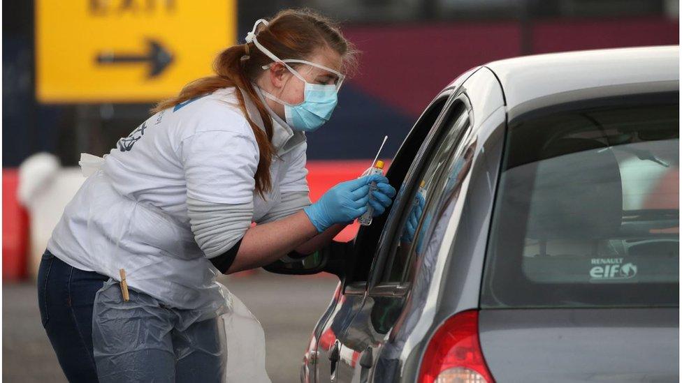 medical worker conducts testing