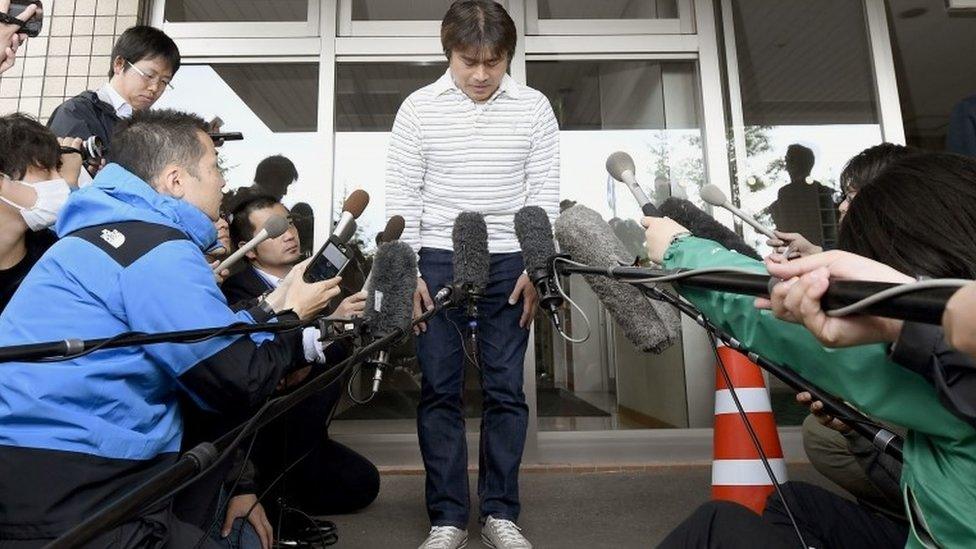 Takayuki Tanooka, father of the 7-year-old Japanese boy who went missing nearly a week ago, bows in front of media after his son was found, in Hakodate, Hokkaido Friday, June 3, 2016.