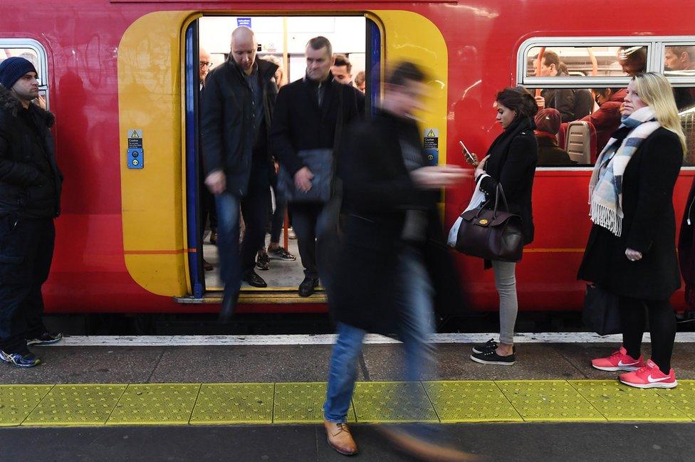 Passengers getting on and off a South Western train at Waterloo