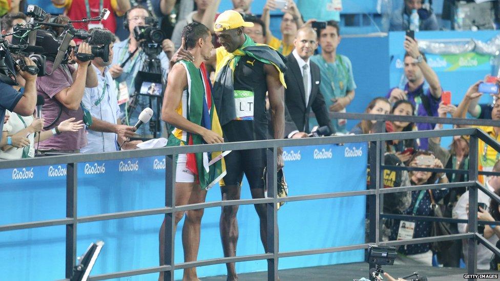 Bolt celebrates with Wayde van Niekerk.