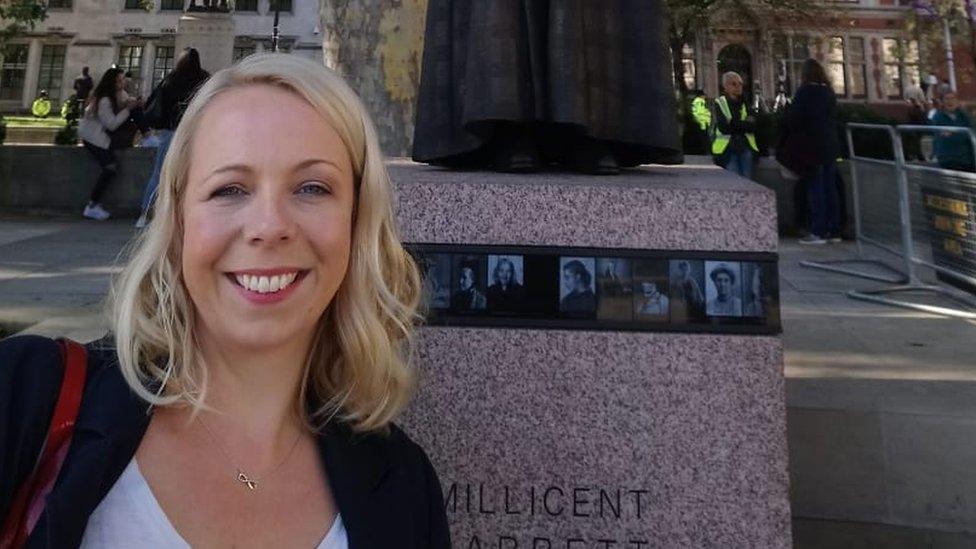 Clare Roberts-Molloy in front of the statue of Millicent Fawcett in London earlier this year