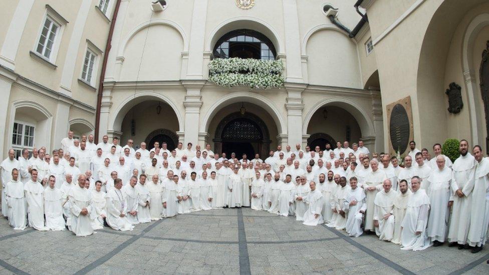 Pope Francis poses with priests at the Jasna Gora monastery