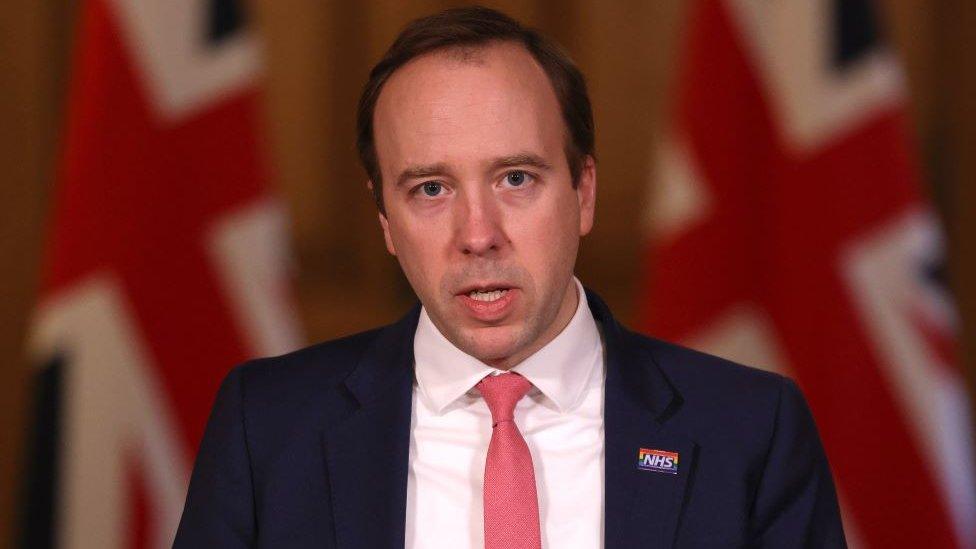 Matt Hancock stands at the 'protect the NHS' lectern