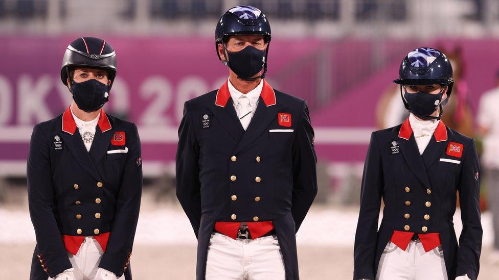 Bronze medalist Charlotte Dujardin, Carl Hester and Charlotte Fry of Team Great Britain