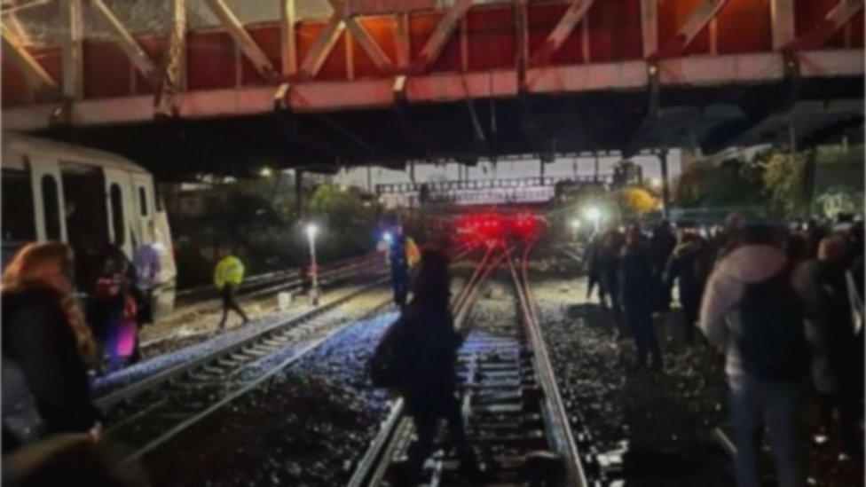 People being evacuated from an Elizabeth Line train