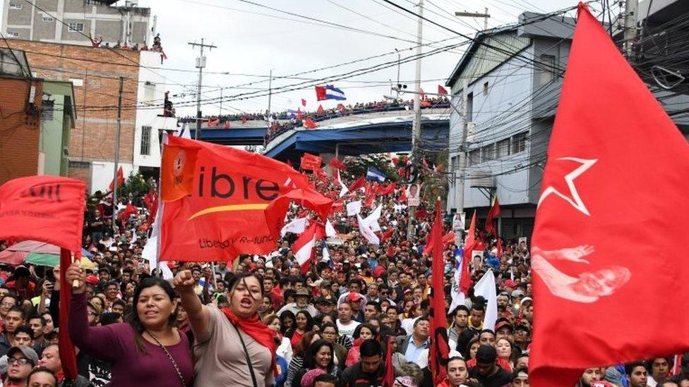 Supporters of Presidential candidate for the Honduran Opposition Alliance against the Dictatorship, Salvador Nasralla take part in a demonstration in front the Supreme Electoral Tribunal (TSE) in Tegucigalpa, on November 27, 2017.