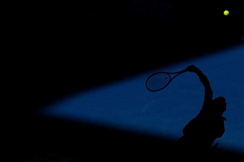 A silhouette of the Australian Open's defending champion Novak Djokovic