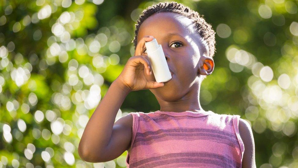 Boy using an inhaler