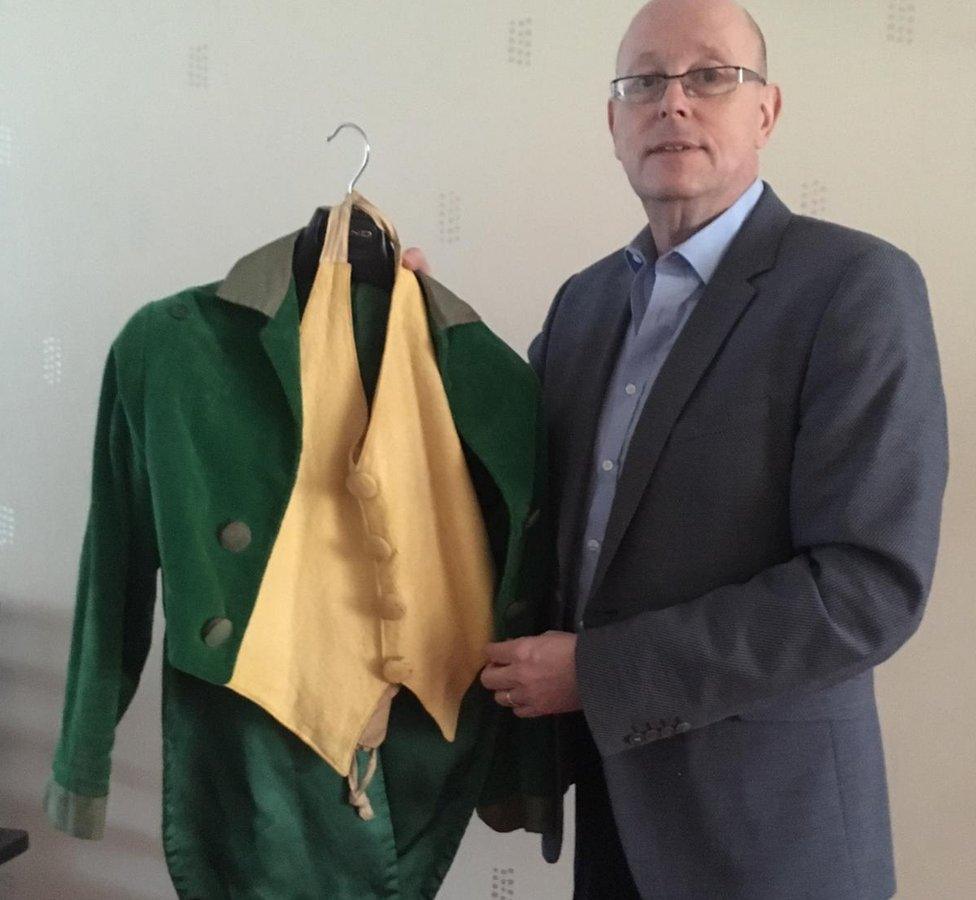 Conor Doyle holding an iconic costume from the movie Darby O'Gill and the Little People