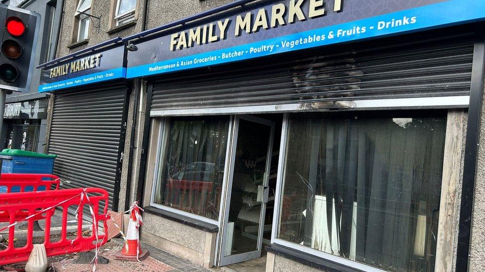 The front of the shop following Sunday's arson attack