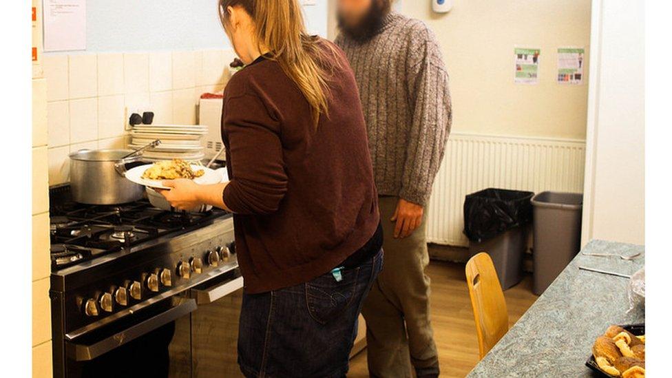 Food being served in a homeless shelter