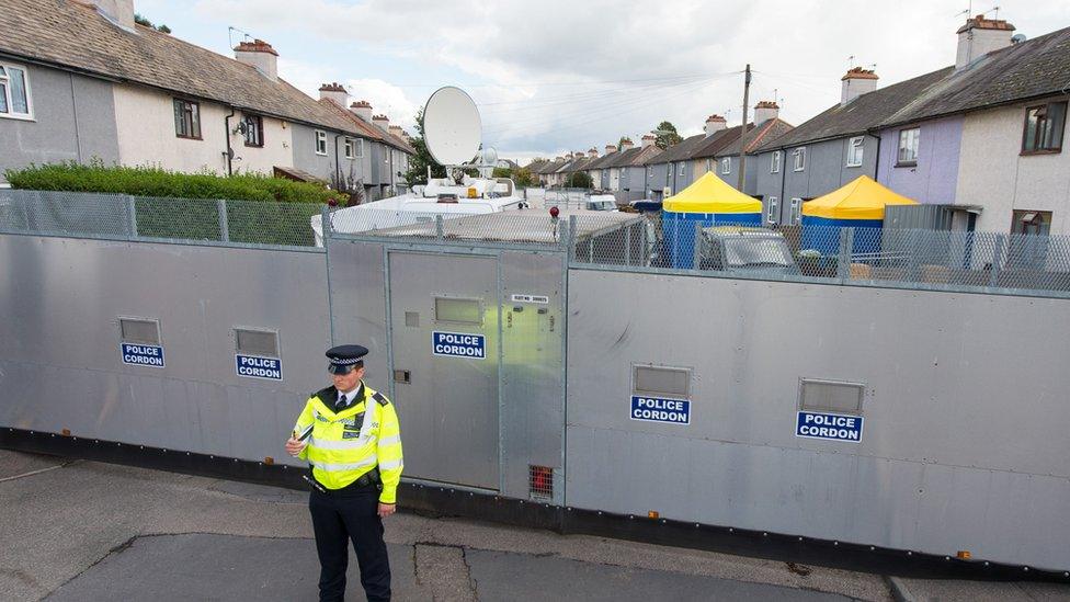 Police searching a house in Sunbury