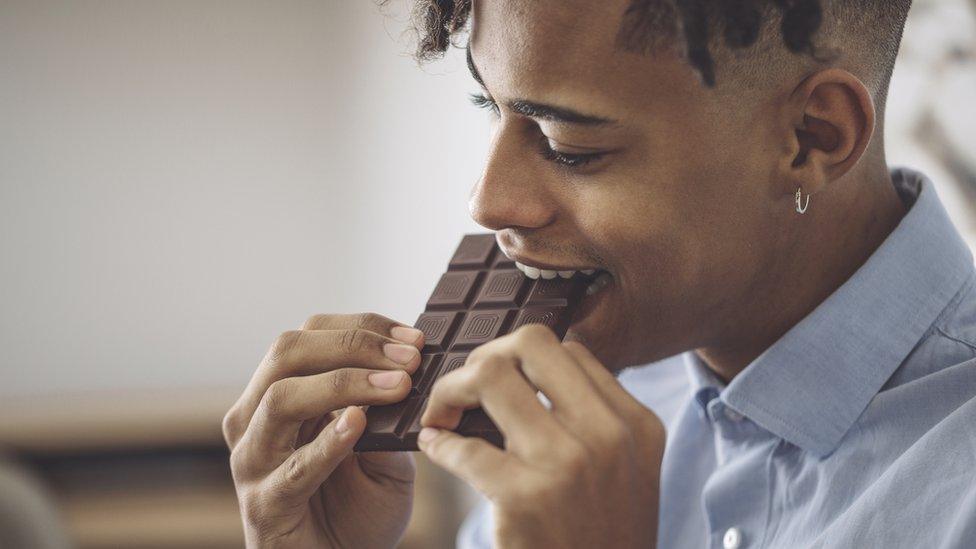 Man eating chocolate