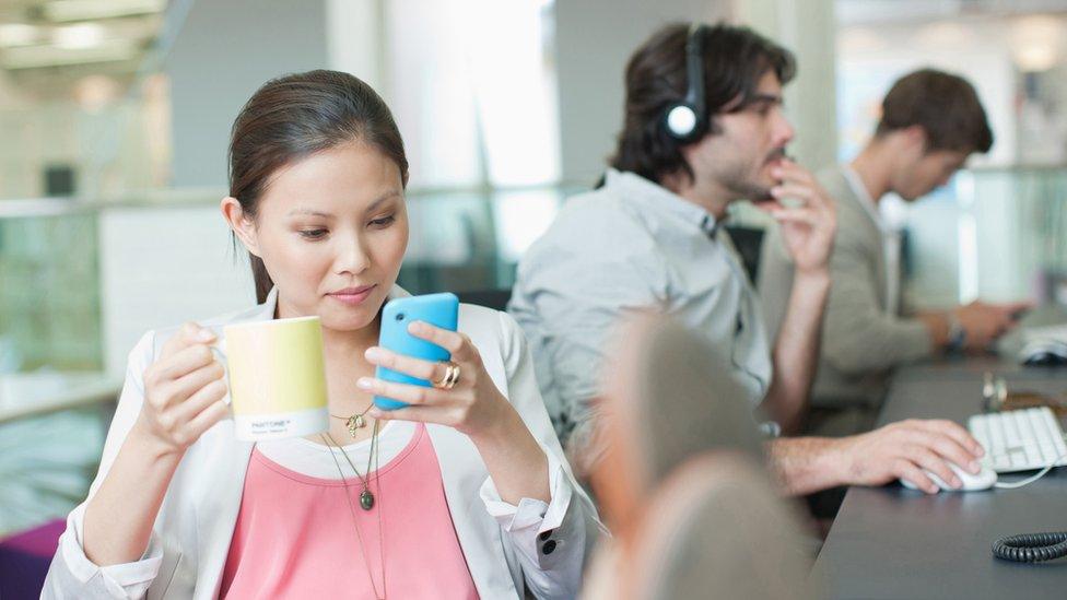 Woman on phone at work