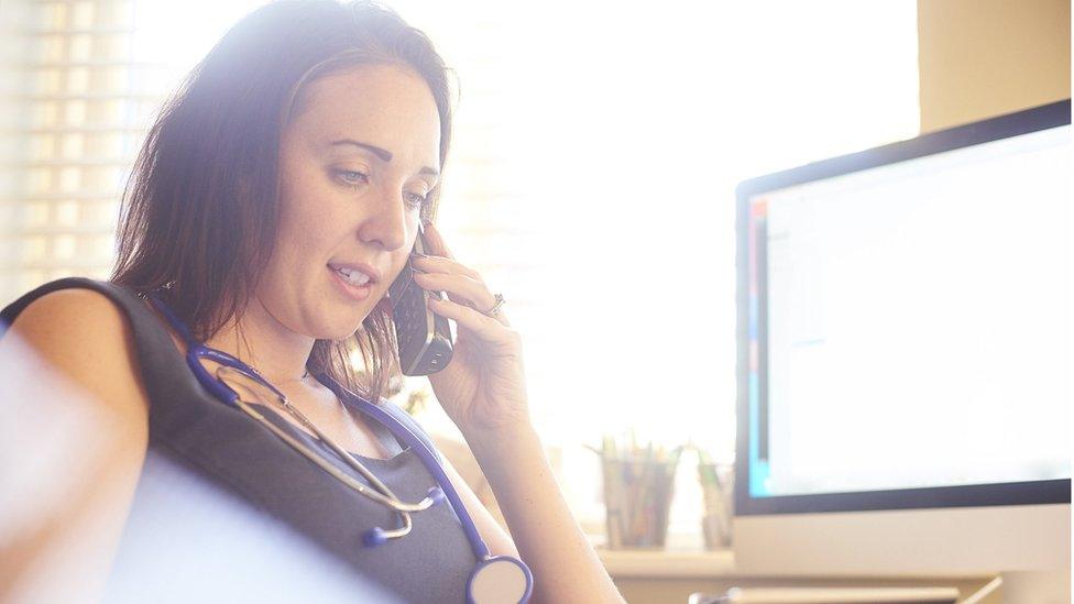 Female doctor talking on phone