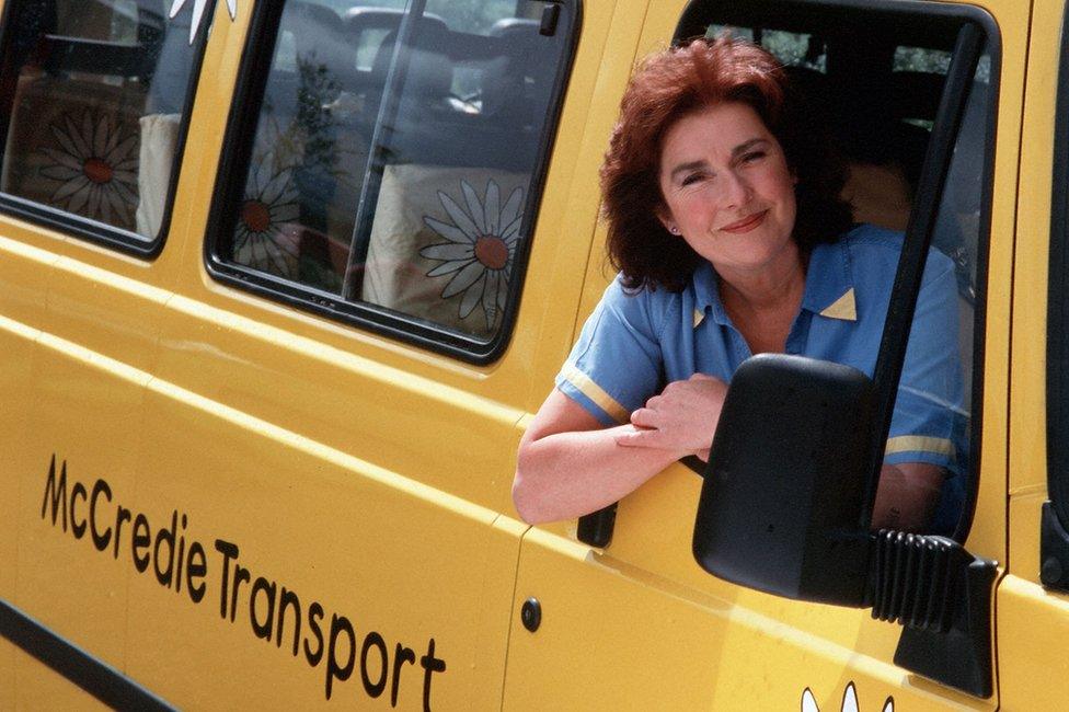 Edie McCredie driving the Balamory Bus.