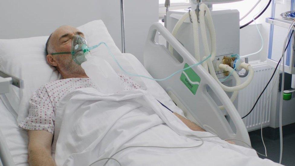 Sick man on ventilator