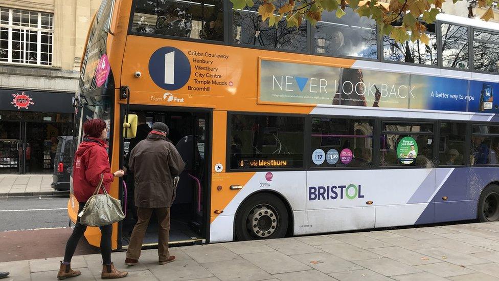 Passengers getting on bus