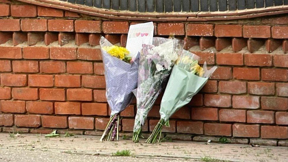 Flowers left at scene of crash