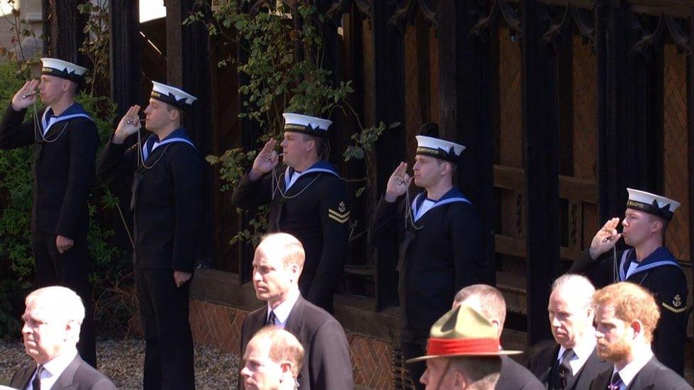 A Royal Navy Piping Party pipes the Still