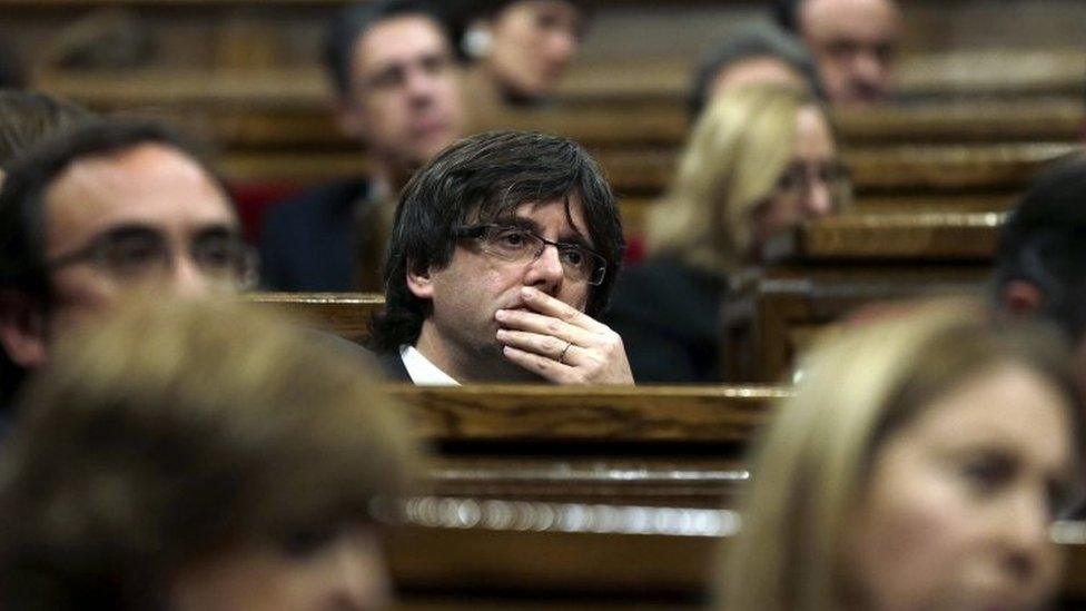 Carles Puigdemont reacts during his vote of confidence at the regional Parliament in Barcelona