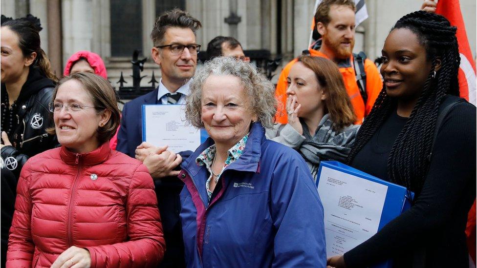 Green Party peer Jenny Jones and lawyers outside the High Court in London on October 24