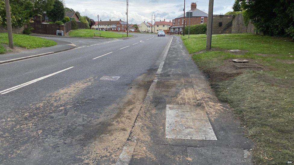 Fire marks on road and pavement