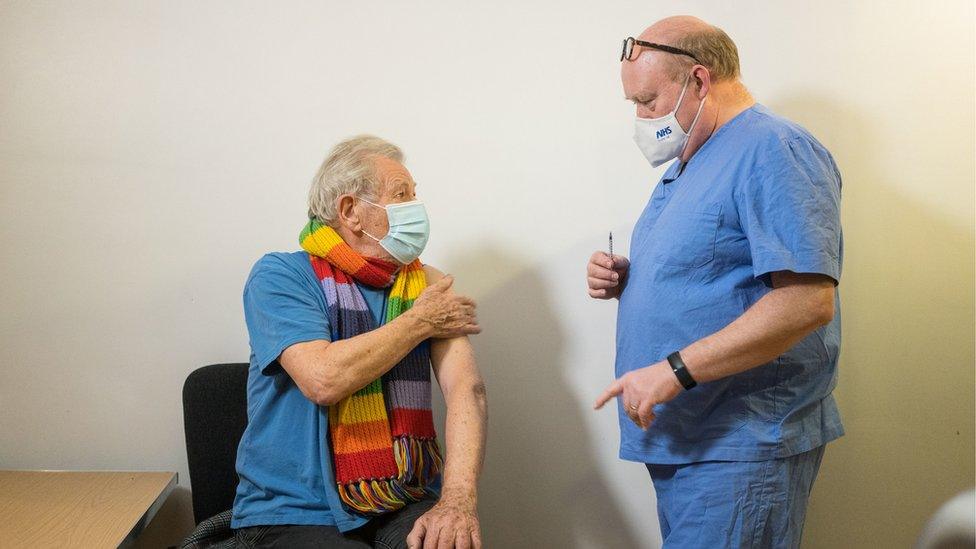 Sir Ian McKellen talking to a GP about the vaccine