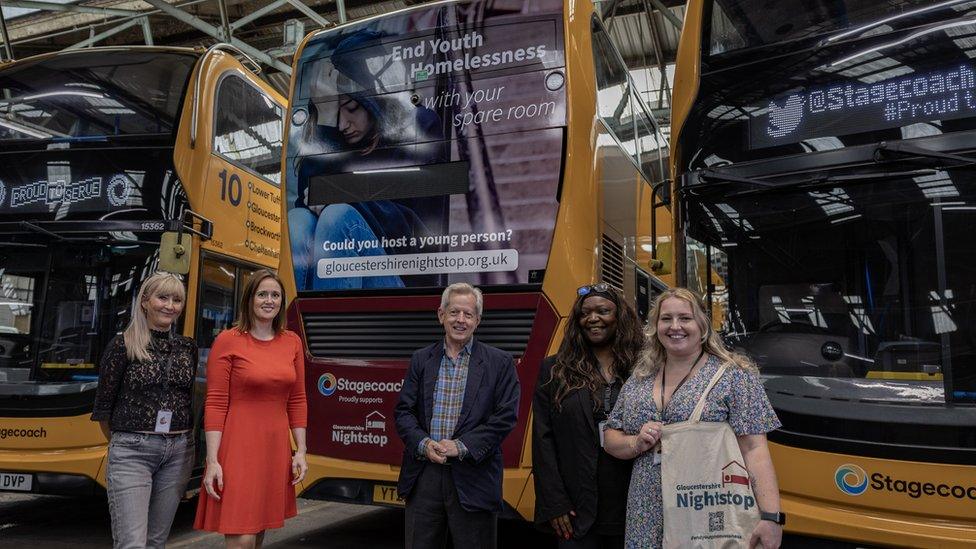 Elaine Pearson and a stagecoach bus with a Nightstop advertisement on it