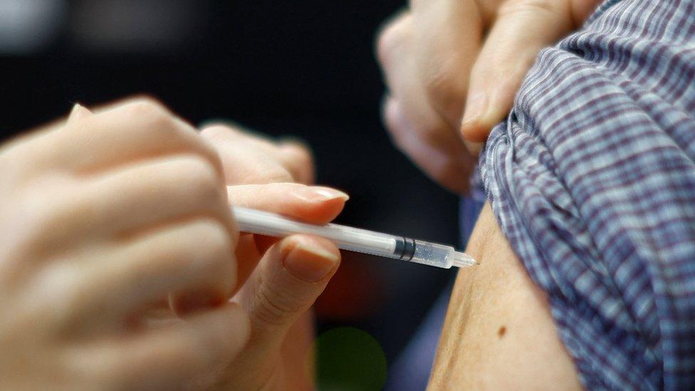 Person receiving Covid vaccine