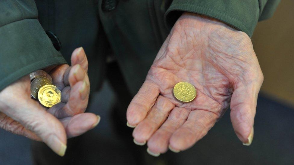 Hands holding money