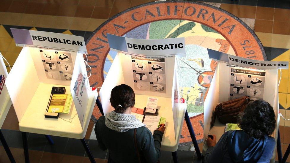 Voters cast their ballot in City Hall, Santa Monica, California, on 7 June 2016