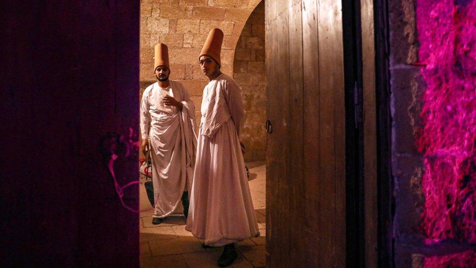 Whirling dervishes prepare to perform at the Amir Taz Palace in Cairo, Egypt on March 27, 2024.