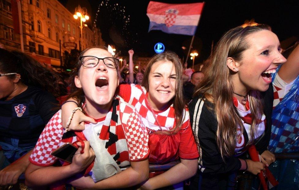 Croatia's supporters celebrate a goal as they watch Croatia -V-England at the main square in Zagreb