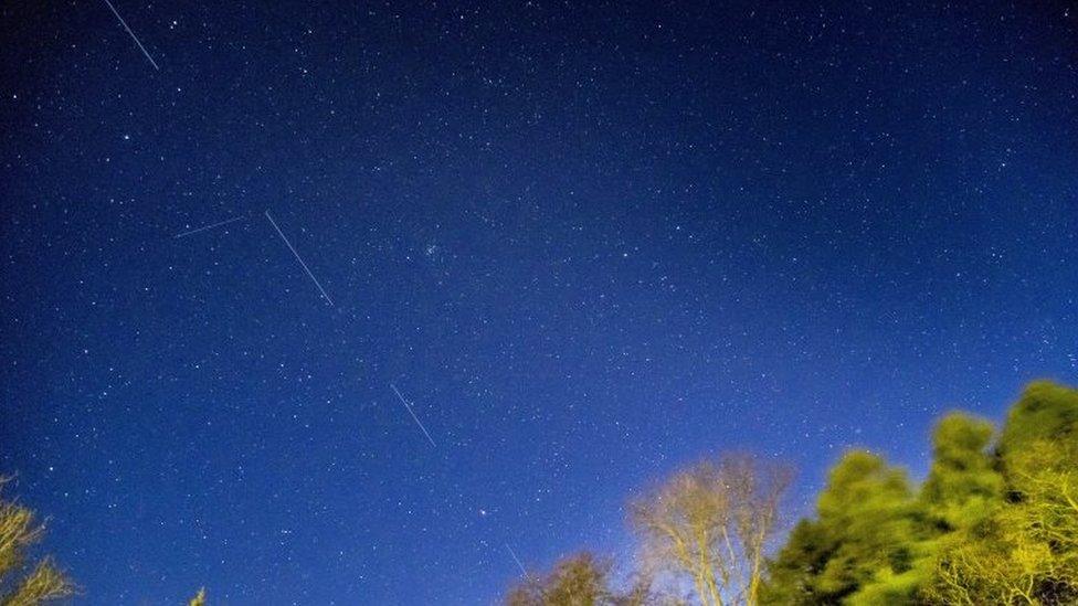 SpaceX Starlink satellites are pictured in the sky seen from Svendborg on South Funen, Denmark April 21, 2020.