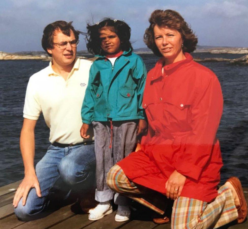 A young Kiran with her parents