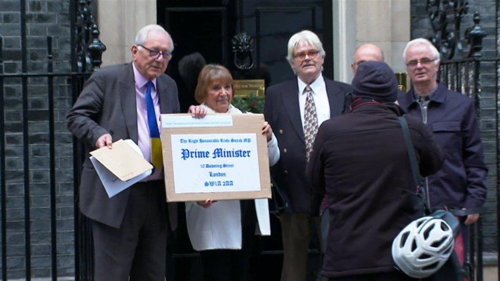 Campaigners delivering a letter to Downing Street