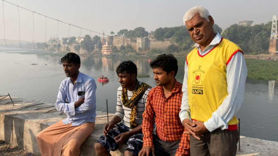 Parbat Govind (standing) and labourers who took part in the initial rescue efforts