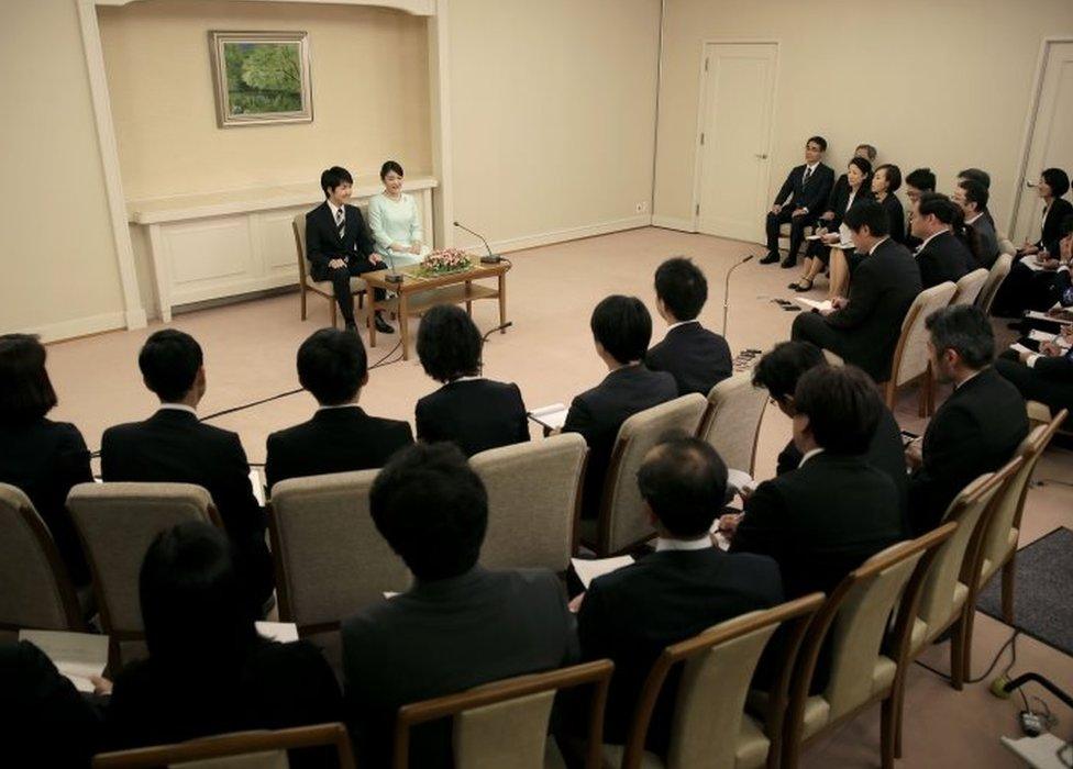 Princess Mako (top 2nd L), the eldest daughter of Prince Akishino and Princess Kiko, speaks to the media with her fiancee Kei Komuro, during a press conference to announce their engagement at the Akasaka East Residence in Tokyo on September 3, 2017.