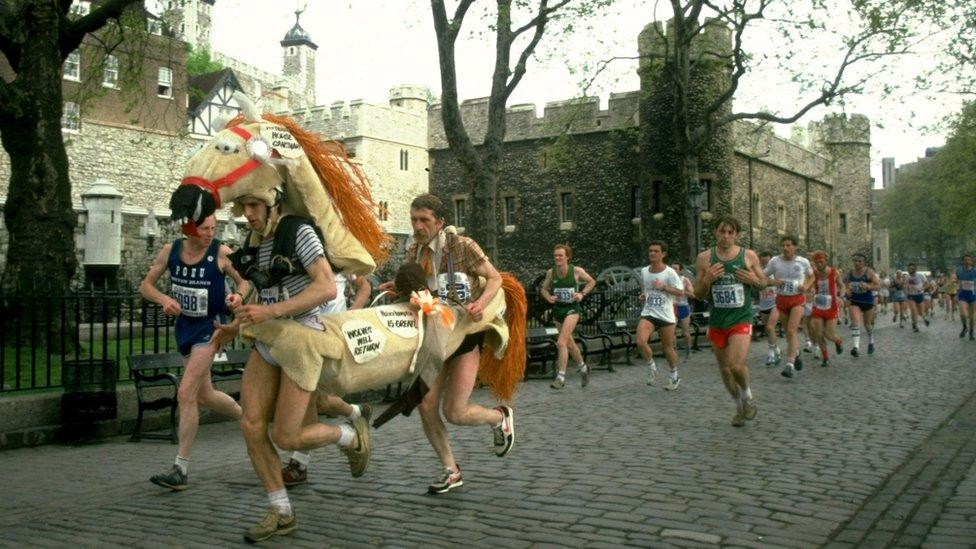 A pantomime horse runs past the Tower of London during the marathon in 1982