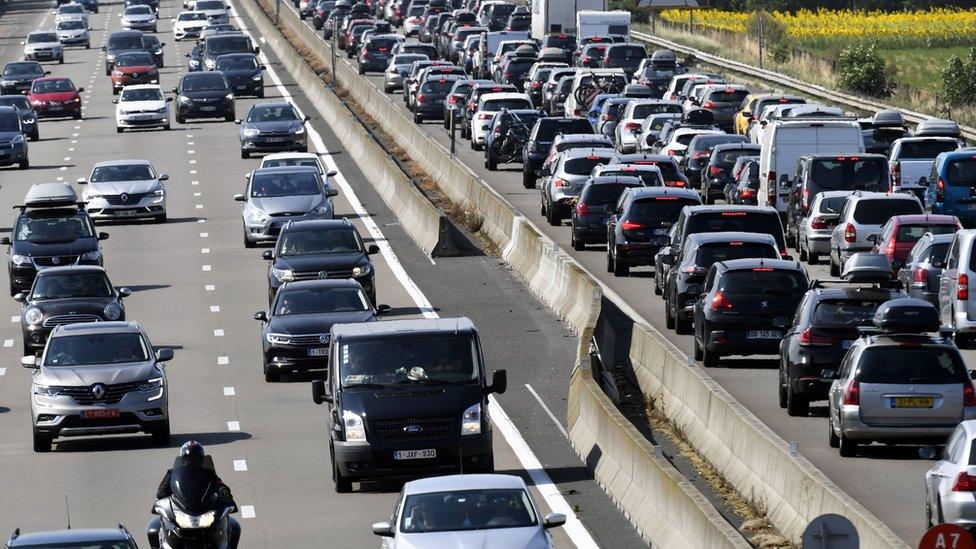 Motorists drive in France