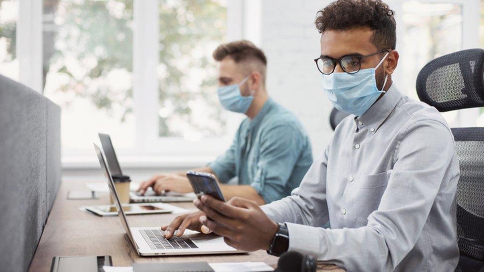 Office workers wearing masks