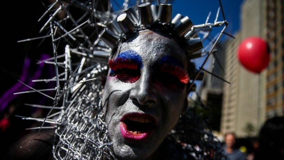 A man in body paint joins the Gay Pride parade in Sao Paulo.