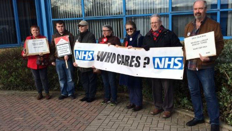 A small protest was held outside the meeting